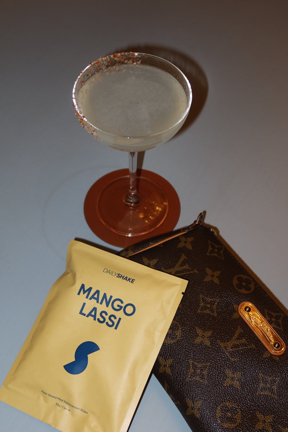 Mango Lassi Australian protein powder sachet styled at a Sydney community dinner